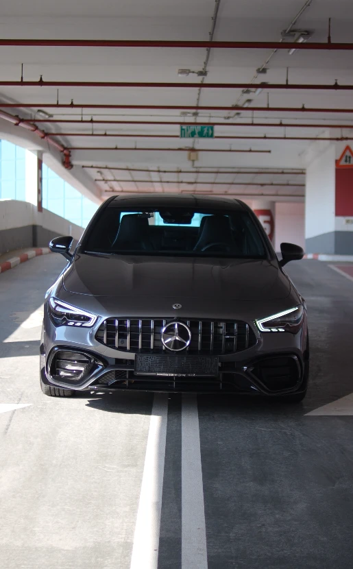 Mercedes-AMG CLA 45 S 4MATIC+ front 4K raw footage — Panamericana grille in dramatic parking garage lighting